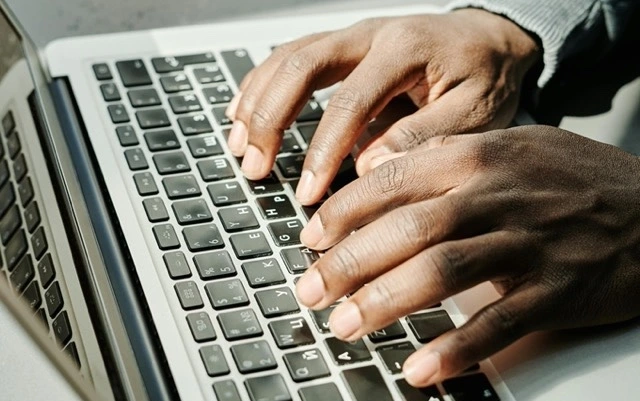man working on a Macbook